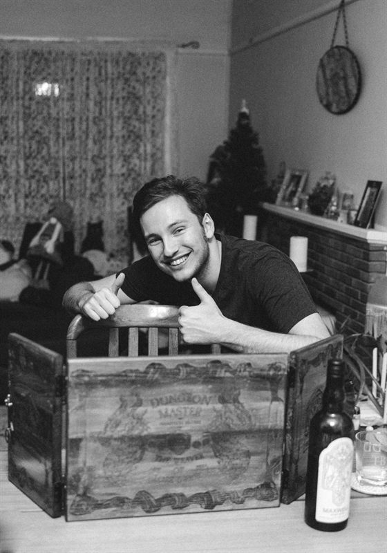 The founder of The Mana Reserve behind a Dungeon Master&rsquo;s screen, grinning and giving two thumbs up.
